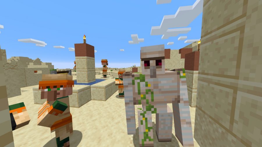 Villaggio di Minecraft nel deserto con un golem di ferro e un abitante del villaggio